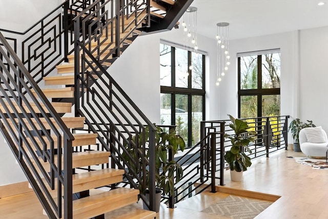 stairway with wood finished floors