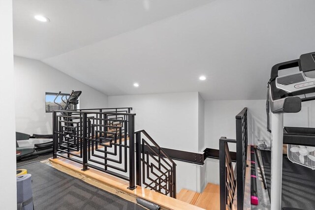 hall featuring an upstairs landing, recessed lighting, lofted ceiling, and carpet