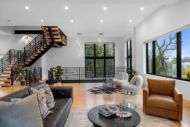 living area featuring wood finished floors and recessed lighting