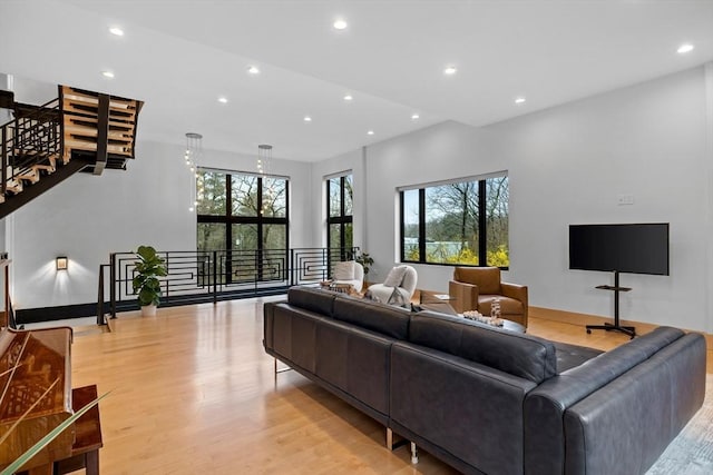 living room with recessed lighting and light wood finished floors