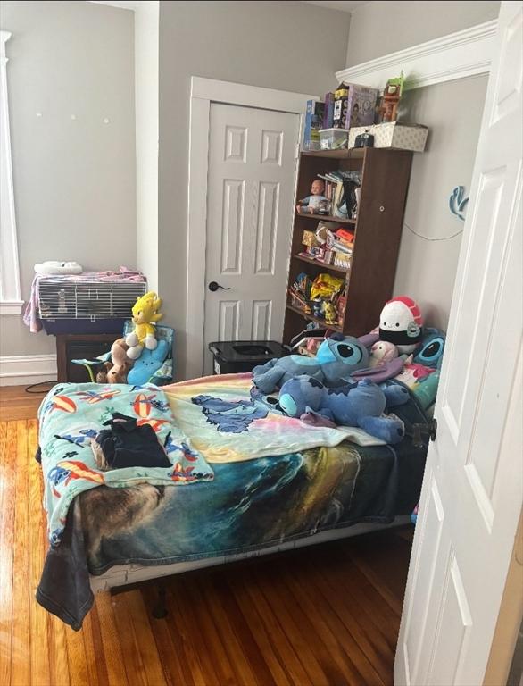 bedroom with wood finished floors