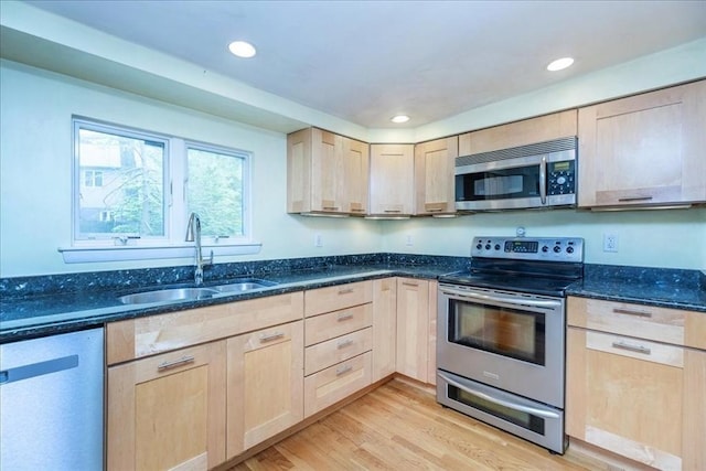 68 Walnut Rd, Swampscott, MA 01907 - kitchen with light brown cabinetry, stainless steel appliances, a sink, dark stone counters, and light wood finished floors