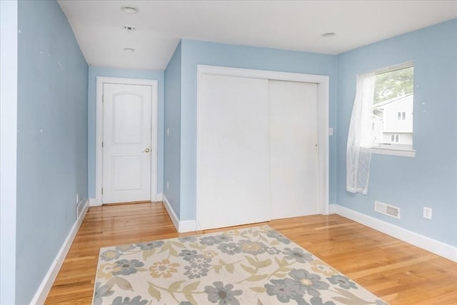 68 Walnut Rd, Swampscott, MA 01907 - unfurnished bedroom featuring light wood finished floors, baseboards, and a closet