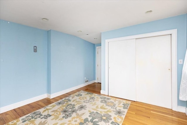 68 Walnut Rd, Swampscott, MA 01907 - unfurnished bedroom with wood finished floors, a closet, baseboards, and recessed lighting