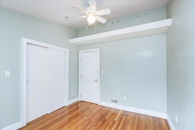 68 Walnut Rd, Swampscott, MA 01907 - unfurnished bedroom with baseboards, wood finished floors, a closet, and ceiling fan