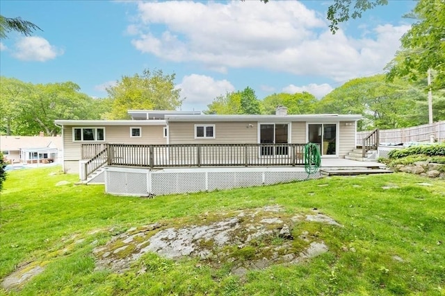 68 Walnut Rd, Swampscott, MA 01907 - back of property with a yard and a wooden deck