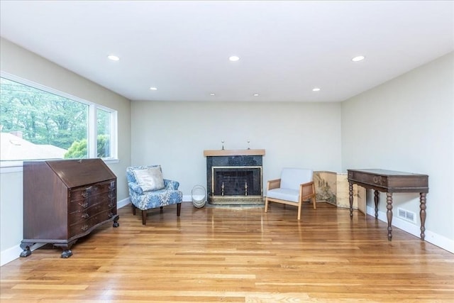 68 Walnut Rd, Swampscott, MA 01907 - sitting room with light wood finished floors, recessed lighting, a fireplace, and baseboards