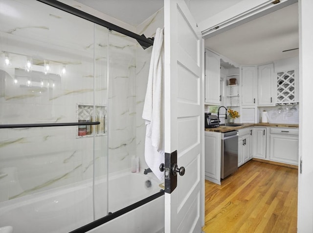 4 Darling St, Worcester, MA 01605 - full bathroom featuring combined bath / shower with glass door, vanity, and wood finished floors