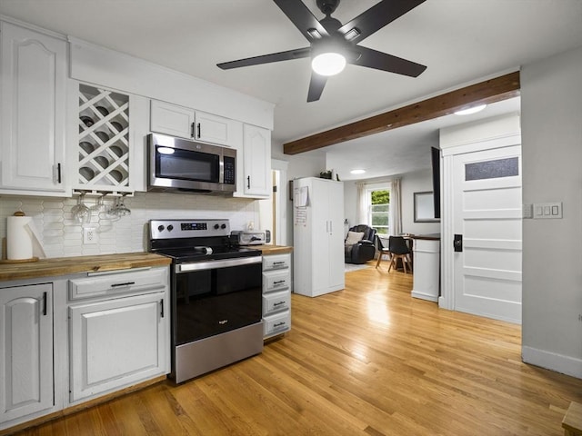 4 Darling St, Worcester, MA 01605 - kitchen with stainless steel appliances, wood counters, white cabinets, backsplash, and ceiling fan