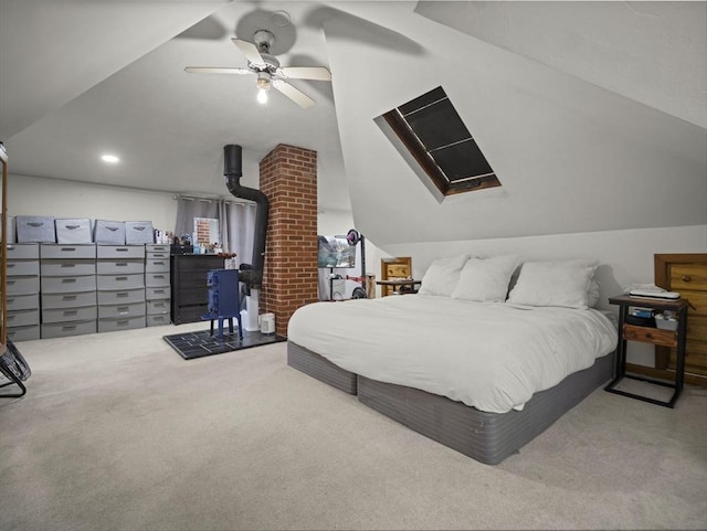 4 Darling St, Worcester, MA 01605 - carpeted bedroom with a skylight, vaulted ceiling, a wood stove, and ceiling fan