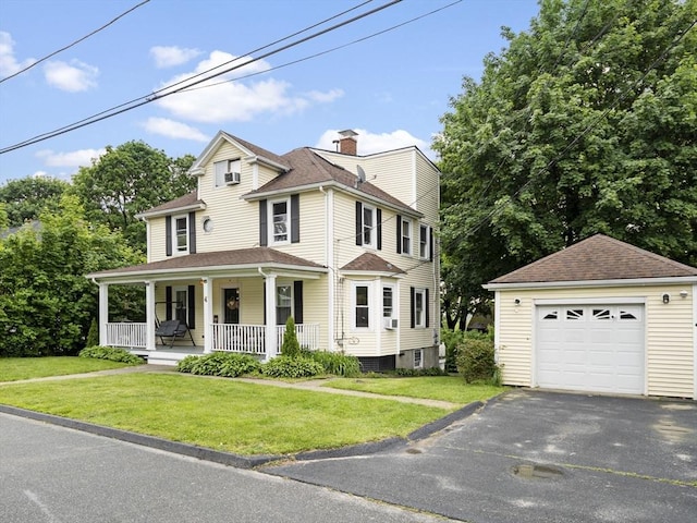 4 Darling St, Worcester, MA 01605 - view of front facade with a porch, an outbuilding, a front lawn, and a detached garage