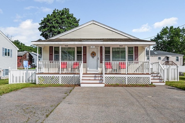 33 Hopkins St, Dracut, MA 01826 - bungalow-style home with covered porch