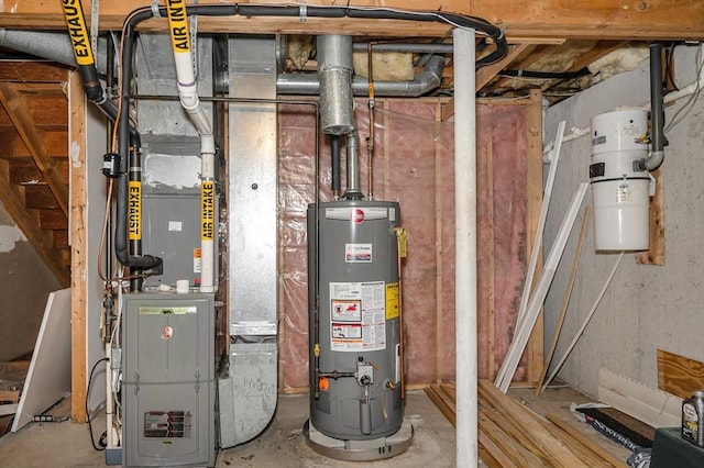 33 Hopkins St, Dracut, MA 01826 - utility room featuring gas water heater and a central vacuum unit