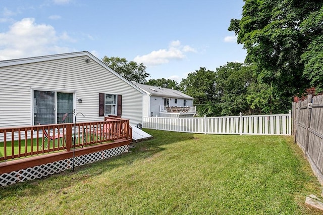 33 Hopkins St, Dracut, MA 01826 - fenced backyard with a wooden deck
