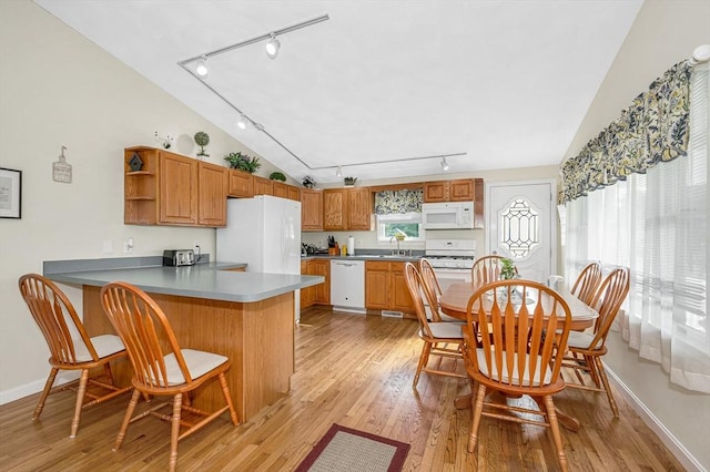 33 Hopkins St, Dracut, MA 01826 - kitchen with track lighting, white appliances, lofted ceiling, a peninsula, and open shelves
