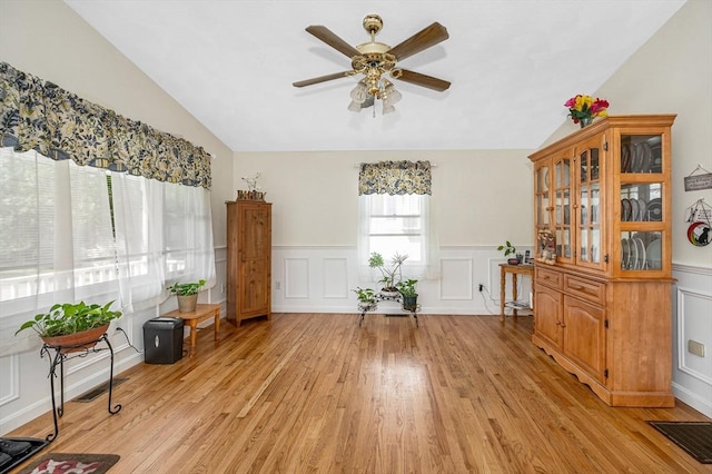 33 Hopkins St, Dracut, MA 01826 - dining room with vaulted ceiling, a ceiling fan, light wood-style floors, a decorative wall, and a wainscoted wall