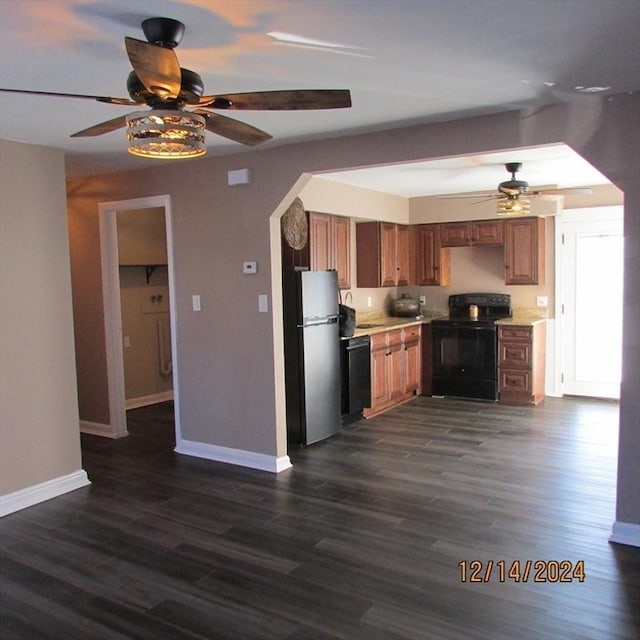 kitchen with dark hardwood / wood-style flooring, ceiling fan, and black appliances