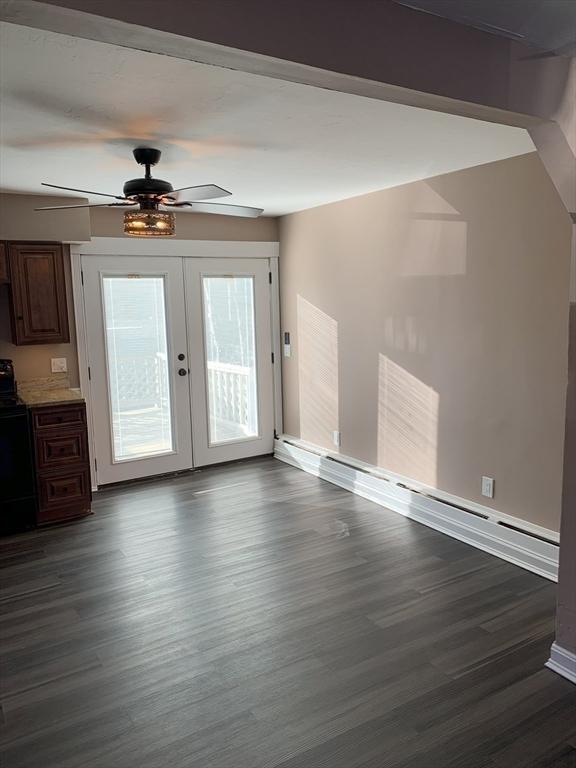 interior space featuring french doors, dark hardwood / wood-style flooring, and ceiling fan