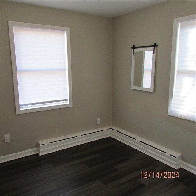 spare room with dark wood-type flooring