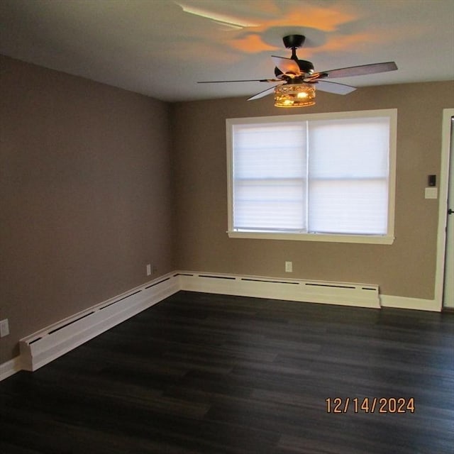 unfurnished room with ceiling fan and dark hardwood / wood-style flooring