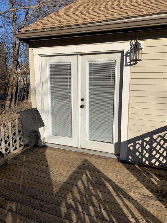 wooden deck featuring french doors