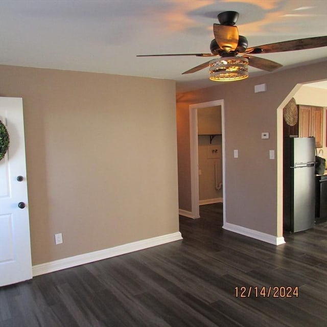 interior space with ceiling fan and dark wood-type flooring