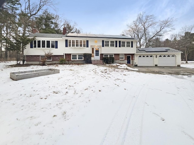 split foyer home featuring solar panels