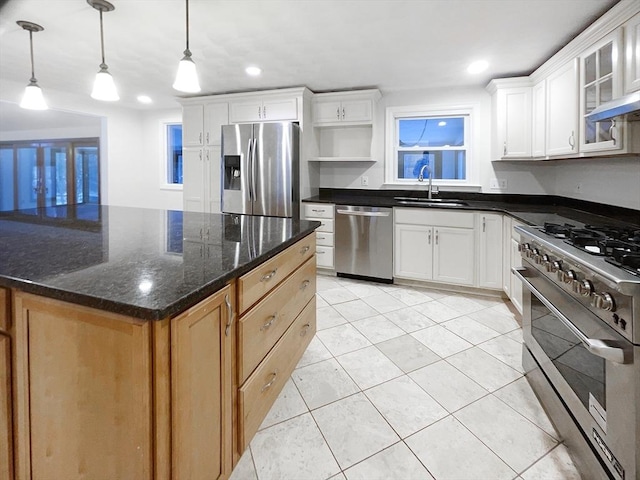 kitchen featuring white cabinets and appliances with stainless steel finishes