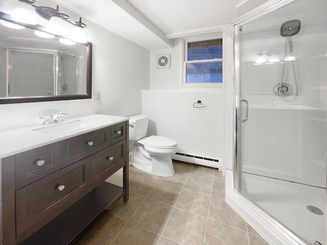 bathroom with vanity, baseboard heating, and a shower with door