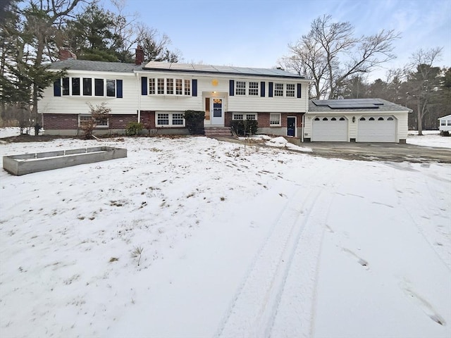 split foyer home featuring solar panels