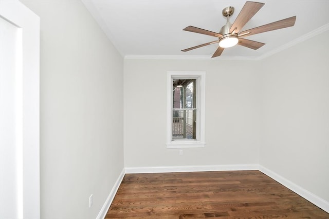 spare room featuring ceiling fan, ornamental molding, and dark wood-type flooring