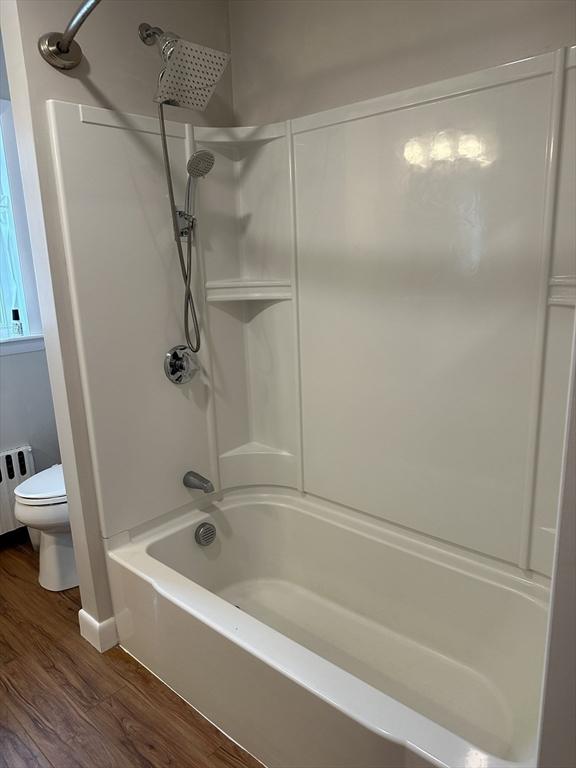 15 Evans, Somerset, MA 02726 - full bathroom featuring wood finished floors, shower / tub combination, and radiator