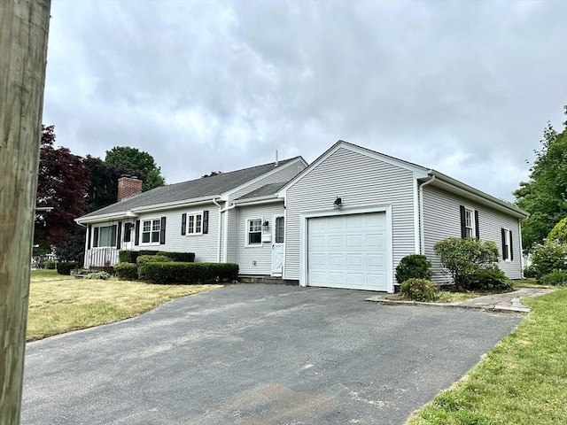 15 Evans, Somerset, MA 02726 - single story home with a garage, a chimney, driveway, and a front lawn