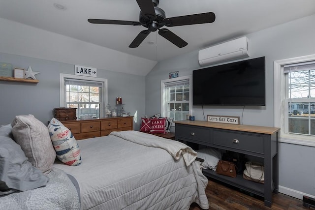 bedroom with lofted ceiling, dark wood-type flooring, ceiling fan, a wall mounted air conditioner, and baseboards