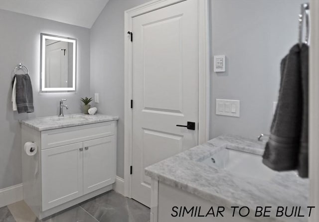10 Webber Ave Unit 1A, Bedford, MA 01730 - bathroom with vanity, baseboards, marble finish floors, and lofted ceiling