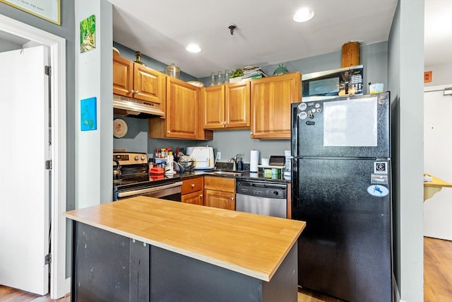 335 Cypress St Unit 2V, Manchester, NH 03103 - kitchen with stainless steel appliances, under cabinet range hood, light wood-style flooring, recessed lighting, and wood counters