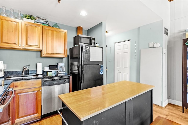 335 Cypress St Unit 2V, Manchester, NH 03103 - kitchen featuring black appliances, light wood-style floors, a kitchen island, and recessed lighting