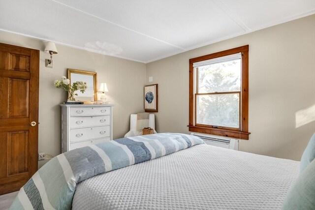 bedroom with a wall unit AC