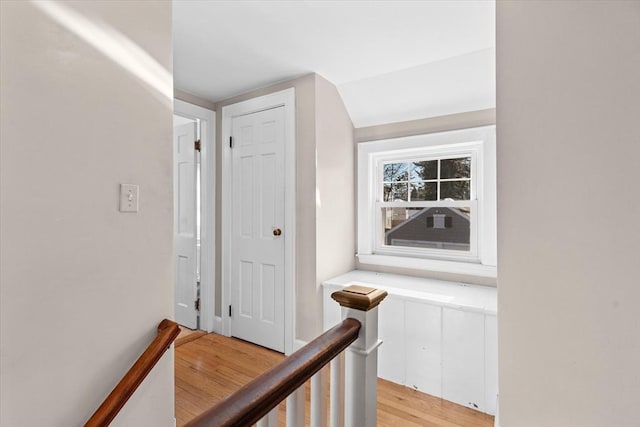 corridor featuring lofted ceiling