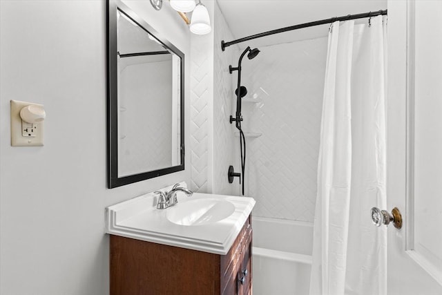 bathroom featuring shower / bath combo with shower curtain and vanity