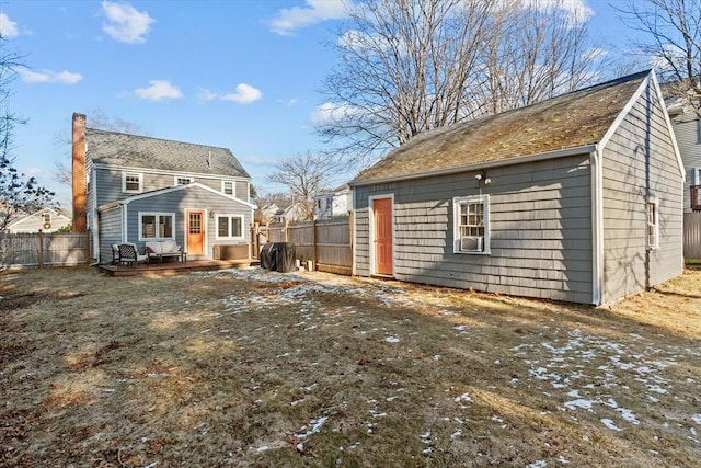 rear view of property with a deck and cooling unit