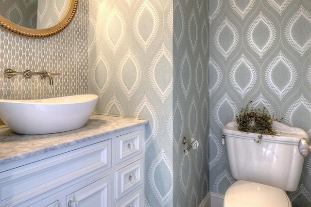 bathroom with vanity and toilet