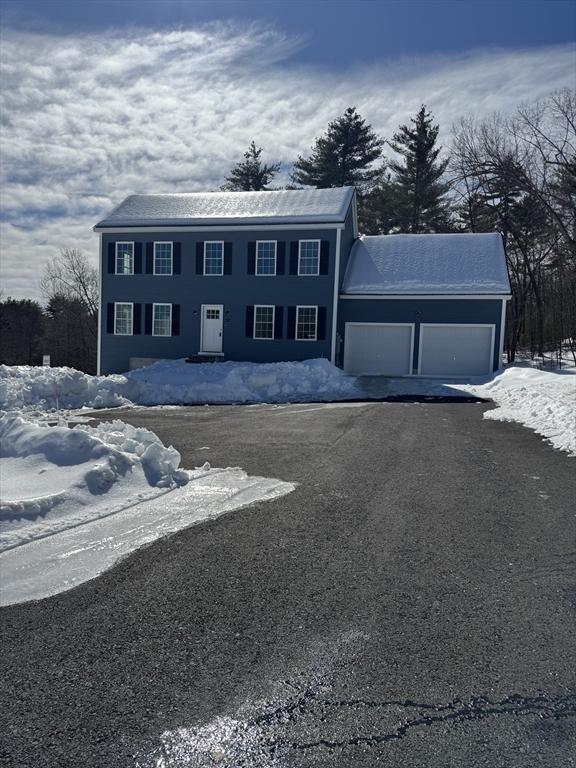 colonial-style house with an attached garage