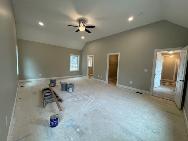 interior space with lofted ceiling, ceiling fan, baseboards, and recessed lighting