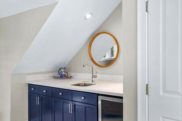 bathroom featuring recessed lighting, beverage cooler, vaulted ceiling, and vanity