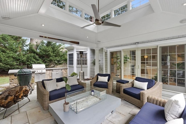 view of patio with ceiling fan, an outdoor living space, french doors, exterior kitchen, and grilling area