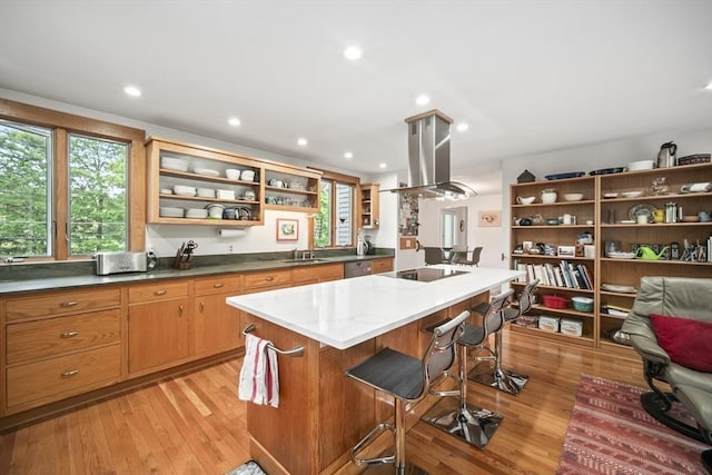 424 Sudbury St, Marlborough, MA 01752 - kitchen featuring open shelves, island range hood, a sink, black electric cooktop, and a kitchen breakfast bar