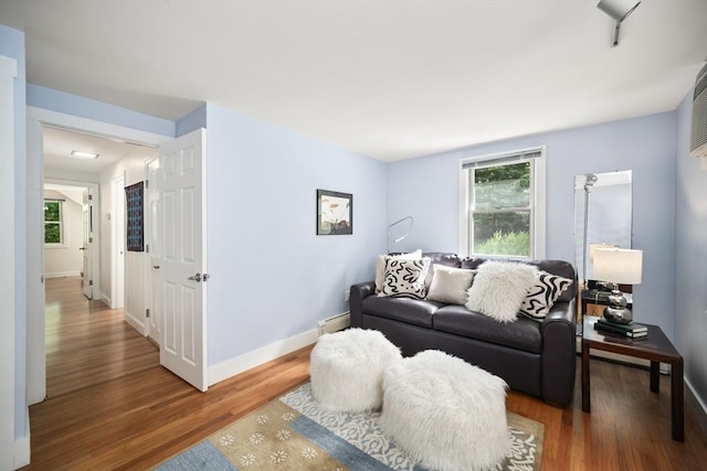424 Sudbury St, Marlborough, MA 01752 - living room with wood finished floors, plenty of natural light, and baseboards