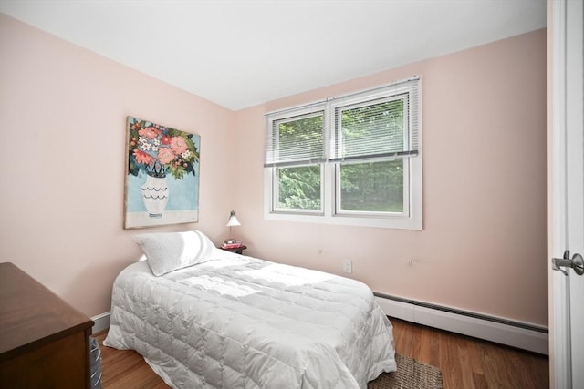 424 Sudbury St, Marlborough, MA 01752 - bedroom with a baseboard radiator, wood finished floors, and baseboards