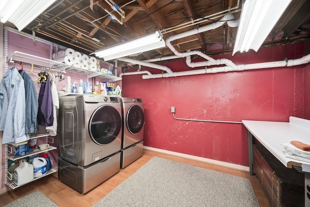 424 Sudbury St, Marlborough, MA 01752 - laundry room with independent washer and dryer, wood finished floors, and baseboards